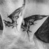 Tatuaggio alla caviglia in inchiostro nero piccolo di Inez Janiak del pipistrello