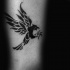 Small black ink forearm tattoo of tribal wall painting eagle
