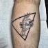 Small black ink leg tattoo of triangle with skeleton hand and lettering