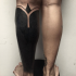 Small black ink leg tattoo of various ornaments