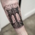 Small black ink photo like forearm tattoo of famous city bridge