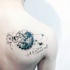 Small black ink scapular tattoo of various planets and lettering