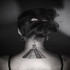 Small black ink upper back tattoo of Mayan pyramid