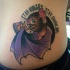 Small cartoon style side tattoo of bat with pizza and lettering