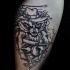 Small homemade style arm tattoo of evil raccoon with Tommy gun