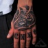 Small illustrative style hand tattoo of playing cards with dice