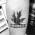 Small linework style black ink arm tattoo of maple leaf with date