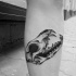 Tatuagem nova da perna do estilo da escola nova do crânio velho do animal com dentes