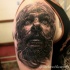 Spectacular 3D style very detailed shoulder tattoo of woman with beard