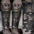 Spectacular black ink arm tattoo of demonic man with human skull