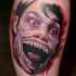 Spectacular colored tattoo of creepy zombie monster face