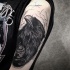 Spectacular engraving style black ink shoulder tattoo of mystical crow