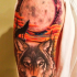 Spectacular looking colored shoulder tattoo of of wolf with big moon