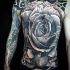 Spectacular looking colored whole chest and belly tattoo of rose flower