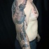 Spectacular unfinished colored and detailed sleeve tattoo of angel warrior with demon