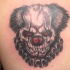 spaventoso faccia scheletro di pagliaccio tatuaggio