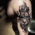 Stippling style black and white shoulder tattoo of lion