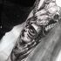 Stippling style black ink forearm tattoo of woman with animal skull