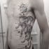 Stippling style black ink side tattoo of corrupted cat