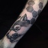 Stippling style black ink tattoo of evil wolf with ornaments