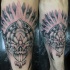 Stippling style colored arm tattoo of fantasy demonic skull