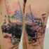 Stippling style colored thigh tattoo of rhino with geometrical ornaments
