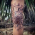 Stippling style hypnotic ornaments tattoo on knee