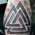 Stone like colored ancient symbols tattoo with lettering