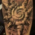 Stonework style black and white forearm tattoo of mystic symbol