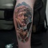 Stonework style colored leg tattoo of Jesus statue with vine