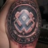 Stonework style colored shoulder tattoo of ancient tablet