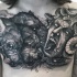 Stonework style cool looking chest tattoo of Cerberus with Medusa head