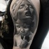 Stonework style detailed shoulder tattoo of devils kid and woman with hood