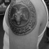 Stonework style detailed shoulder tattoo of ancient tablet with goat