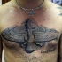 Stonework style large beautiful looking chest tattoo of ancient symbol