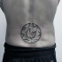Strange looking black ink waist tattoo of mystical ornament