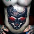 Stunning 3D style colored belly tattoo of corrupted human skull