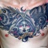 Stunning black and white multicolored hell dog and crow tattoo on chest combined with old witch face and lettering