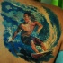 Stunning colored scapular tattoo of surfer in big wave