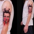 Stunning colored shoulder tattoo of demonic woman portrait and black line