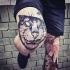 Stunning painted black ink knee tattoo of cat face