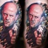 Tatuaje en el brazo, Jason Statham estupendo muy realista con pistola