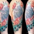 Superior illustrative style colored shoulder tattoo of pigeon with flowers