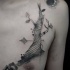 Surrealism style black ink chest tattoo of interesting looking tree with moon