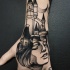 Tatuagem de mão estilo blackwork estilo surrealismo de cabeça de mulher com o velho castelo por Michele Zingales
