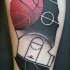 Surrealism style colored basketball themed shoulder tattoo