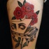 Surrealism style colored thigh tattoo of piano with human eyes and flowers