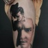 Surrealism style colored thigh tattoo of man with hat