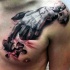Surrealism style colroed demonic hand tattoo on chest and shoulder stylized with puzzle