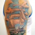 Sweet looking colored shoulder tattoo of awesome sailing ship